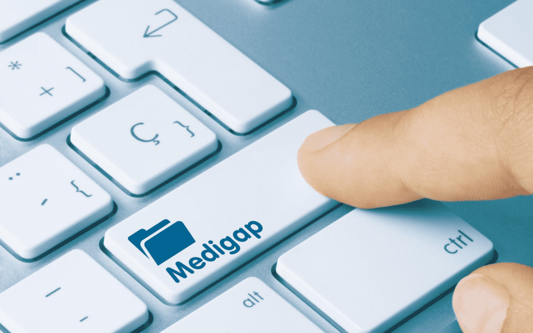Medigap written on white key of metallic keyboard.
